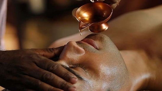 Nasya: Instilling medicated nasal drops in both nostrils making nasal defense system strong and active by preventing infection from going further into the lungs.(Kerala Toursim)