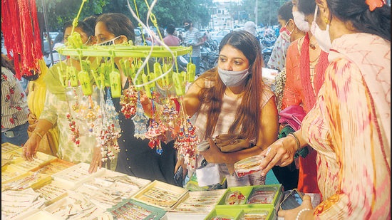With Covid cases going down, shopkeepers reported a 50% jump in Rakhi sales this year as compared to a lacklustre affair last year due to the pandemic. Rain also couldn’t play spoilsport as residents poured in to tricity markets to shop for the festivities. (RAVI KUMAR/HT)