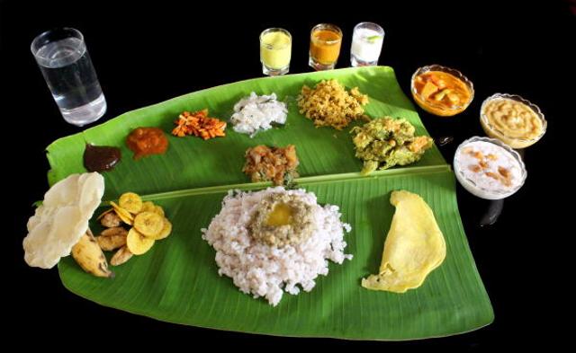 Onam Sadhya is served on a banana leaf. Onam Sadhya is served on a banana leaf.