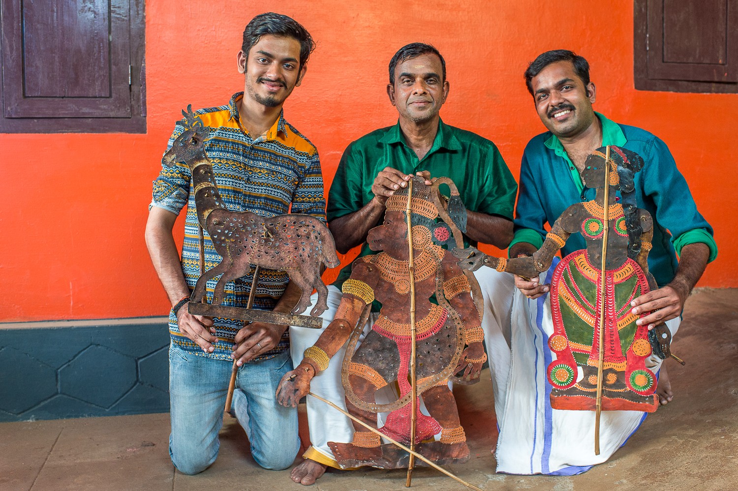 Ramachandra Pulavar (centre) and his sons Rahul and Rajiv are using current tales and online platforms to promote Kerala’s ancient shadow puppetry.