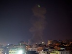 Explosions light up the night sky above buildings in Gaza City as Israeli forces shell the Palestinian enclave, early on August 22, 2021. Explosions light up the night sky above buildings in Gaza City as Israeli forces shell the Palestinian enclave, early on August 22, 2021.