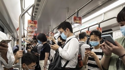 Passengers use their smartphones while riding a subway train in Shanghai, China. (Bloomberg/Used only for representative purpose) Passengers use their smartphones while riding a subway train in Shanghai, China. (Bloomberg/Used only for representative purpose)