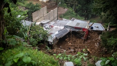 The Moreno family home, which was buried by a landslide during the passage of Hurricane Grace, in Xalapa, Veracruz State, Mexico, on Saturday, August 21. (AP) The Moreno family home, which was buried by a landslide during the passage of Hurricane Grace, in Xalapa, Veracruz State, Mexico, on Saturday, August 21. (AP)