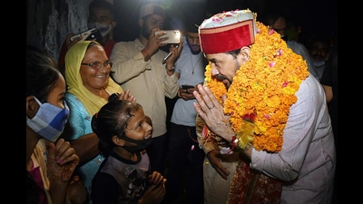 Union minister of information and broadcast Anurag Thakur interacting with people during his Jan Ashirvad Yatra in Nadaun on Sunday. (ANI)