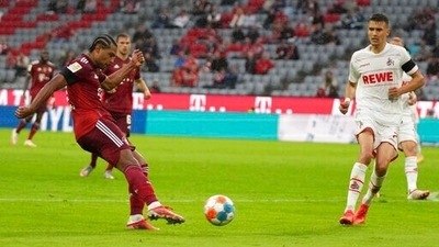 Bayern Munich's Serge Gnabry scores during the German Bundesliga soccer match against Cologne (AP)