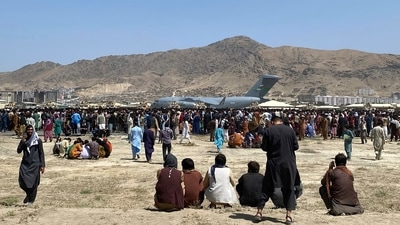 Afghans have been crowding the Kabul airport in a desperate dash to flee the country after the Taliban took over. (AP Photo) Afghans have been crowding the Kabul airport in a desperate dash to flee the country after the Taliban took over. (AP Photo)