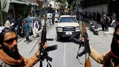 Taliban terrorists patrol a street in Kabul (AP) Taliban terrorists patrol a street in Kabul (AP)