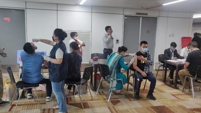 The Union minister attached a photo of the vaccine drive, which is already underway at the Delhi international airport. (Photo via @mansukhmandviya on Twitter) The Union minister attached a photo of the vaccine drive, which is already underway at the Delhi international airport. (Photo via @mansukhmandviya on Twitter)