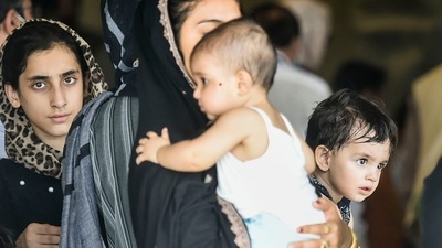 People who were stranded in crisis-hit Afghanistan arrive by a special repatriation flight of IAF at the Hindan Air Force Station, in Ghaziabad, on Sunday. (PTI) People who were stranded in crisis-hit Afghanistan arrive by a special repatriation flight of IAF at the Hindan Air Force Station, in Ghaziabad, on Sunday. (PTI)
