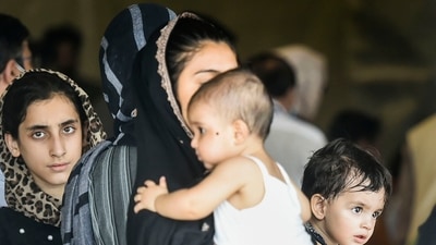 People who were stranded in crisis-hit Afghanistan arrive by a special repatriation flight of IAF at the Hindan Air Force Station, in Ghaziabad, on Sunday. (PTI) People who were stranded in crisis-hit Afghanistan arrive by a special repatriation flight of IAF at the Hindan Air Force Station, in Ghaziabad, on Sunday. (PTI)