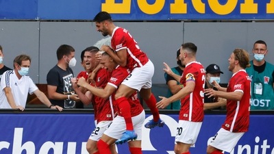 Freiburg's Roland Sallai, left, celebrates scoring with teammates. (AP) Freiburg's Roland Sallai, left, celebrates scoring with teammates. (AP)