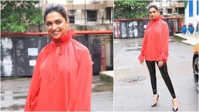 Deepika Padukone opted for this red puffed sleeves top which she teamed with black leather pants for her mother-in-law's birthday lunch outing. (HT Photo/Varinder Chawla)