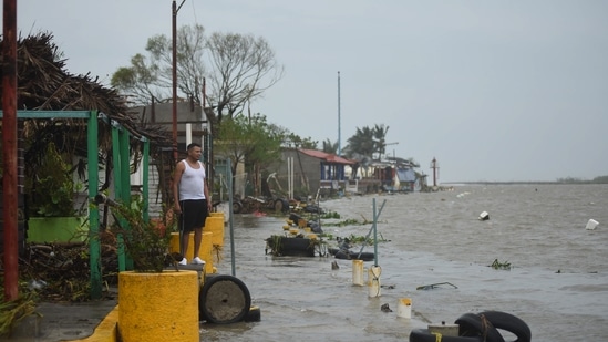A resident surveys a flooded neighborhood after Hurricane Grace made landfall in Tecolitla, Veracruz state, Mexico, on Saturday, August 21. (Bloomberg)