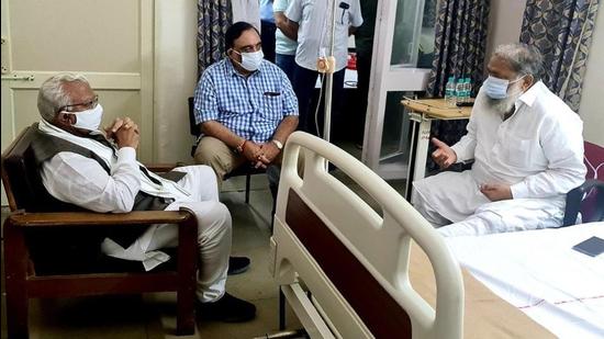 Haryana chief minister Manohar Lal Khattar visiting home minister Anil Vij at PGIMER on Saturday. (HT PHOTO)