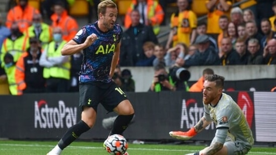 Tottenham's Harry Kane has a shot on goal during the English Premier League soccer match against Wolverhampton Wanderers(AP)