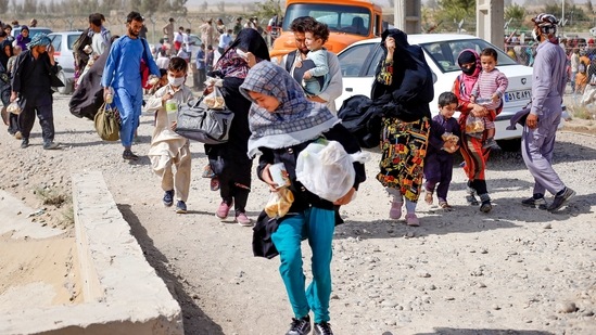 Afghan refugees at the Iran-Afghanistan border.(AFP)