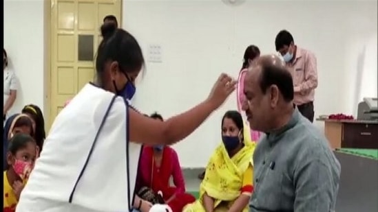 In the program organised at the Lok Sabha Camp Office, more than two dozen women and daughters tied Rakhi to Lok Sabha Speaker Om Birla. (ANI Photo)