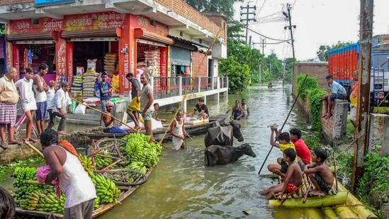 While in Hajipur people have moved to higher altitudes along with their cattle and family making it difficult for them to survive. (PTI Photo)(PTI) While in Hajipur people have moved to higher altitudes along with their cattle and family making it difficult for them to survive. (PTI Photo)(PTI)