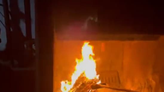 A video grab of the principal setting ablaze to all documents of her students that she said was for their safety. (Twitter@sbasijrasikh)