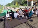 Farmers block railway tracks during their protest demanding higher sugarcane state advisory price (SAP), in Jalandhar on Monday.(ANI Photo) Farmers block railway tracks during their protest demanding higher sugarcane state advisory price (SAP), in Jalandhar on Monday.(ANI Photo)