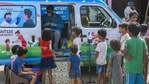 Underprivileged children wait outside a van decorated with toys for their Covid-19 test in New Delhi. (ANI PHOTO.) Underprivileged children wait outside a van decorated with toys for their Covid-19 test in New Delhi. (ANI PHOTO.)
