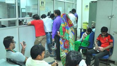 People lined up at an MC office in Panchkula. Any violation is liable to criminal prosecution. (HT File Photo)