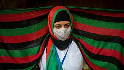 Afghans residing in India take part in a demonstration outside the UN Refugee Agency ( UNHCR) office in New Delhi on August 23 to protest against the Taliban's military takeover of Afghanistan. (AFP)