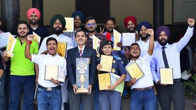 Prize winners in a jubilant mood at SCD Government College on Monday. (Harsimar pal Singh/HT)