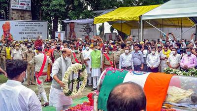Defence minister Rajnath Singh pays his last respects to BJP veteran Kalyan Singh before his cremation in Bulandshahr, Uttar Pradesh, on Monday. (PTI Photo) Defence minister Rajnath Singh pays his last respects to BJP veteran Kalyan Singh before his cremation in Bulandshahr, Uttar Pradesh, on Monday. (PTI Photo)