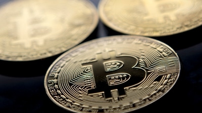 Bitcoin hit a record of almost $65,000 in April, driven higher by a tide of liquidity, fast-money bets and optimism about growing demand from institutional investors. (AFP) Bitcoin hit a record of almost $65,000 in April, driven higher by a tide of liquidity, fast-money bets and optimism about growing demand from institutional investors. (AFP)
