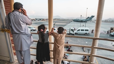 Children point at an aircraft at Hamid Karzai International Airport in Kabul. (AFP Photo) Children point at an aircraft at Hamid Karzai International Airport in Kabul. (AFP Photo)