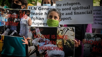 Afghans residing in India take part in a demonstration outside the UN Refugee Agency (UNHCR) office in New Delhi on August 23 to protest against the Taliban's military takeover of Afghanistan and also demanded refugee status and financial security. (AFP) Afghans residing in India take part in a demonstration outside the UN Refugee Agency (UNHCR) office in New Delhi on August 23 to protest against the Taliban's military takeover of Afghanistan and also demanded refugee status and financial security. (AFP)