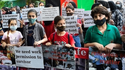 Men, women and children were seen holding the Afghan flag as well as placards and banners that highlighted their demands. (PTI) Men, women and children were seen holding the Afghan flag as well as placards and banners that highlighted their demands. (PTI)