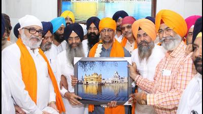 Shiromani Akali Dal senior vice-president and former Punjab minister Anil Joshi being felicitated at the Golden Temple in Amritsar on Monday. (Sameer Sehgal/HT)