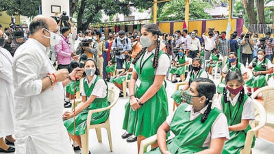 Karnataka chief minister Basavaraj Bommai interacts with students at a school after the state government allowed schools to reopen for Class 9 to 12 in Bengaluru on Monday. (PTI) Karnataka chief minister Basavaraj Bommai interacts with students at a school after the state government allowed schools to reopen for Class 9 to 12 in Bengaluru on Monday. (PTI)