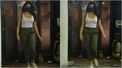Janhvi rounded off her ensemble with lace-up sneakers, a black face mask, side-parted open locks and a brown tote bag. What do you think of Janhvi's outfit? (HT Photo/Varinder Chawla)