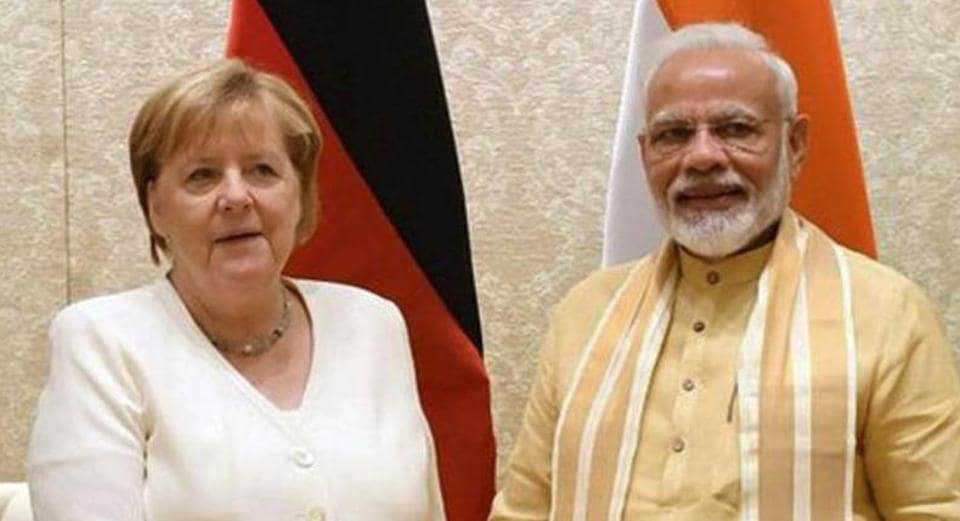 Former German chancellor Angela Merkel and Prime Minister Narendra Modi.&nbsp; (PTI file photo)