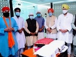 Union ministers Hardeep Singh Puri and V Muraleedharan and BJP leader Sardar RP Singh receive the copies of Guru Granth Sahib brought from Kabul. (PTI Photo) Union ministers Hardeep Singh Puri and V Muraleedharan and BJP leader Sardar RP Singh receive the copies of Guru Granth Sahib brought from Kabul. (PTI Photo)