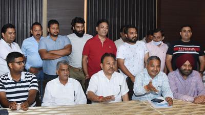 Members of Ludhiana Hotmix Plant Welfare Association addressing the media in Ludhiana on Tuesday. (Gurpreet Singh/HT)