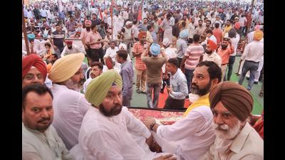 Leader of opposition Harpal Singh Cheema (2L) with others during a protest in Patiala on Tuesday.
