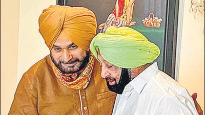 Punjab chief minister Captain Amarinder Singh with state Congress chief Navjot Singh Sidhu during a meeting in Chandigarh on August 20. (PTI) Punjab chief minister Captain Amarinder Singh with state Congress chief Navjot Singh Sidhu during a meeting in Chandigarh on August 20. (PTI)