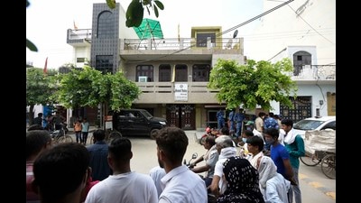 Gurugram, India - August 24, 2021: Police personnel and people outside the house where a man killed four people including a child at Rajendra Park near Radha Krishna Mandir in Gurugram, India on Tuesday, 24 August 2021. (Photo by Parveen Kumar/Hindustan Times) (Parveen Kumar/HT Photo) Gurugram, India - August 24, 2021: Police personnel and people outside the house where a man killed four people including a child at Rajendra Park near Radha Krishna Mandir in Gurugram, India on Tuesday, 24 August 2021. (Photo by Parveen Kumar/Hindustan Times) (Parveen Kumar/HT Photo)