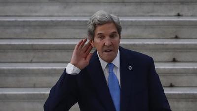 US Special Presidential Envoy for Climate John Kerry gestures as he poses during a photo opportunity with Italian Minister for Ecological Transition Roberto Cingolani, at Palazzo Reale in Naples, Italy on July 23. (AP) US Special Presidential Envoy for Climate John Kerry gestures as he poses during a photo opportunity with Italian Minister for Ecological Transition Roberto Cingolani, at Palazzo Reale in Naples, Italy on July 23. (AP)