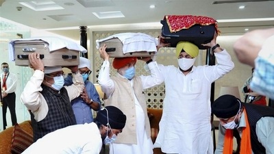 Union minister Hardeep Singh Puri, MoS external affairs V Muraleedharan, BJP leader Sardar RP Singh receive copies of Guru Granth Sahib brought from Kabul, at Terminal 3, IGI airport in New Delhi. (PTI Photo) Union minister Hardeep Singh Puri, MoS external affairs V Muraleedharan, BJP leader Sardar RP Singh receive copies of Guru Granth Sahib brought from Kabul, at Terminal 3, IGI airport in New Delhi. (PTI Photo)