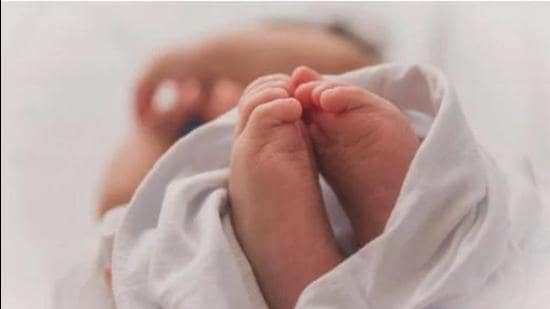 The woman, who claimed to be the biological mother, said a doctor had taken the baby away right after delivery, on the pretext of providing free treatment. (HT PHOTO)
