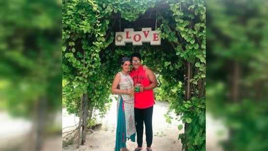 Aditya Narayan and his wife Shweta Agarwal posed under a banner that read, "Love." Sharing this photo, Shweta captioned it, "Roses r red, violets r blue, I smile all day because of you."(Instagram/@shwetaagarwaljha)