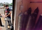 People queue with empty oxygen cylinders to be replaced at Hasanpur Depot, in New Delhi during the second wave in May. People queue with empty oxygen cylinders to be replaced at Hasanpur Depot, in New Delhi during the second wave in May.