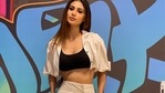 Mouni Roy channels her inner sass and slays the street style trend in a black strap crop top, white crop shirt-like shrug and a pair of white trousers. Mouni Roy channels her inner sass and slays the street style trend in a black strap crop top, white crop shirt-like shrug and a pair of white trousers.