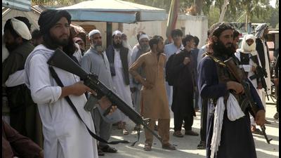 Taliban fighters stand guard on their side while people wait to cross at a border crossing point between Pakistan and Afghanistan, in Torkham, in Khyber district, Pakistan. (AP) Taliban fighters stand guard on their side while people wait to cross at a border crossing point between Pakistan and Afghanistan, in Torkham, in Khyber district, Pakistan. (AP)