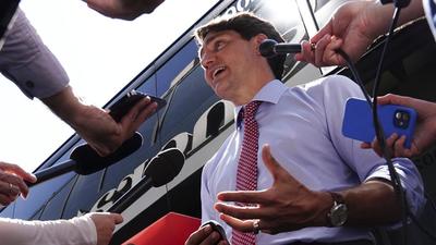 Canadian Prime Minister Justin Trudeau talks with reporters after taking part in a virtual G7 meeting on the crisis in Afghanistan from Hamilton, Ontario, on Tuesday. (AP) Canadian Prime Minister Justin Trudeau talks with reporters after taking part in a virtual G7 meeting on the crisis in Afghanistan from Hamilton, Ontario, on Tuesday. (AP)